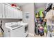 Laundry room with washer, dryer, and ample storage shelving at 3002 Saint George Ct, Burlington, NC 27215