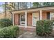 Brick front of house with covered porch and landscaping at 3213 Courtney Ln, Sanford, NC 27330