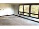 Spacious living room featuring large windows and carpeting at 342 Dare St, Burlington, NC 27217