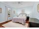 Spacious bedroom with hardwood floors, large window, and neutral color palette at 4027 Green Forest Ct, Rocky Mount, NC 27804