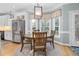 Kitchen breakfast nook with a round wooden table and bay window at 4027 Green Forest Ct, Rocky Mount, NC 27804