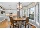 Kitchen breakfast nook with a round wooden table and bay window view at 4027 Green Forest Ct, Rocky Mount, NC 27804