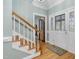 Bright entryway with hardwood floors, staircase, and a glass door at 4027 Green Forest Ct, Rocky Mount, NC 27804