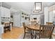 Bright eat-in kitchen with granite island, white cabinets, and stainless steel appliances at 4027 Green Forest Ct, Rocky Mount, NC 27804