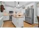 Modern kitchen with stainless steel appliances, granite countertops, and white cabinetry at 4027 Green Forest Ct, Rocky Mount, NC 27804