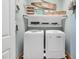Convenient laundry room with washer, dryer, and ample storage shelving at 4027 Green Forest Ct, Rocky Mount, NC 27804