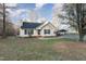 House exterior showcasing a well-maintained lawn and driveway at 4433 Spoon Loop Loop, Liberty, NC 27298