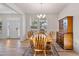 Bright dining room with wooden table and chairs, and a hutch at 46 Two Belles Ct, Angier, NC 27501