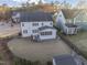 Aerial view of a two-story home with a screened porch, fenced yard, and shed at 5244 Aleppo Ln, Raleigh, NC 27613