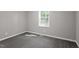 Well-lit bedroom featuring carpet and a window at 567 Howard Tant Rd, Zebulon, NC 27597