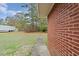 Side yard with walkway and brick exterior at 604 Central Ave, Butner, NC 27509