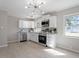 Updated kitchen with stainless steel appliances and white cabinets at 609 E Cockrell St, Nashville, NC 27856