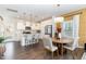 Modern kitchen with white cabinets, island, and stainless steel appliances at 62 Tanglewood Pl, Angier, NC 27501