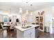 Modern kitchen island with sink, faucet, and pendant lighting at 62 Tanglewood Pl, Angier, NC 27501