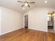 Large bedroom with hardwood floors and access to bathroom at 6625 Suburban Dr, Raleigh, NC 27615