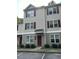 Two-story townhome with neutral siding and burgundy accents at 67 Red Ln, Raleigh, NC 27606