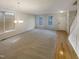 Open living room with hardwood and carpeted floors at 6701 Winding Arch Dr, Durham, NC 27713