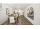 Spacious dining area with a large table and mirrors reflecting light at 8652 Brixton Shay Dr, Raleigh, NC 27616