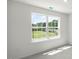 Bright bedroom with large windows and neutral colored carpet at 8654 Brixton Shay Dr, Raleigh, NC 27616