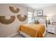 Bright bedroom with a queen bed and stylish decor at 8656 Brixton Shay Dr, Raleigh, NC 27616