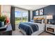 Bedroom with a queen bed, blue bedding, and a view at 8656 Brixton Shay Dr, Raleigh, NC 27616