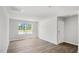 Bonus room with wood-look flooring and window at 8656 Brixton Shay Dr, Raleigh, NC 27616