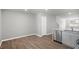 Bright dining area with wood-look flooring and adjacent kitchen at 8656 Brixton Shay Dr, Raleigh, NC 27616