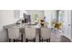 Modern kitchen with granite countertops, stainless steel appliances, and breakfast bar at 8656 Brixton Shay Dr, Raleigh, NC 27616