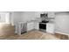 Modern kitchen with stainless steel appliances and granite countertops at 8656 Brixton Shay Dr, Raleigh, NC 27616