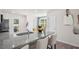 Modern kitchen island with granite countertop and seating at 8656 Brixton Shay Dr, Raleigh, NC 27616