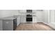 Modern kitchen with stainless steel appliances and granite countertops at 8656 Brixton Shay Dr, Raleigh, NC 27616
