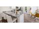 Modern kitchen with granite countertops, stainless steel appliances, and breakfast bar at 8656 Brixton Shay Dr, Raleigh, NC 27616