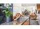Stylish living room showcasing a coffee table with decor, view to kitchen at 8656 Brixton Shay Dr, Raleigh, NC 27616