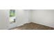 Image of an office space with wood-look flooring and exterior access at 8656 Brixton Shay Dr, Raleigh, NC 27616