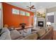 Bright living room with hardwood floors, fireplace, and large windows at 920 Chapanoke Rd, Raleigh, NC 27603