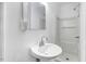 Clean bathroom with pedestal sink, shower, and mirror at 923 Belvedere St, Rocky Mount, NC 27803