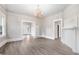 Open concept dining area with hardwood floors and built-in shelving at 923 Belvedere St, Rocky Mount, NC 27803