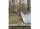 Spacious backyard with a shed and wooded area at 6232 Dawn Dr, Hurdle Mills, NC 27541