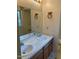 Double vanity bathroom with wood cabinets at 6232 Dawn Dr, Hurdle Mills, NC 27541