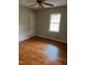 Bedroom with hardwood floors, ceiling fan and window at 6232 Dawn Dr, Hurdle Mills, NC 27541
