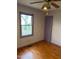 Bright bedroom featuring hardwood floors and a window at 6232 Dawn Dr, Hurdle Mills, NC 27541