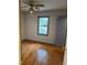 Hardwood floor bedroom with window and door at 6232 Dawn Dr, Hurdle Mills, NC 27541