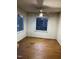 Room with hardwood floors and a view of wooded area at 6232 Dawn Dr, Hurdle Mills, NC 27541