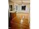 Bright dining area with hardwood floors and access to kitchen at 6232 Dawn Dr, Hurdle Mills, NC 27541