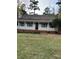 House exterior with a large yard and inviting front porch at 6232 Dawn Dr, Hurdle Mills, NC 27541