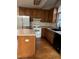 Kitchen with wood cabinets, island, and stainless steel appliances at 6232 Dawn Dr, Hurdle Mills, NC 27541