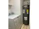 Laundry room with washer, dryer and water heater at 6232 Dawn Dr, Hurdle Mills, NC 27541