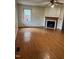 Living room featuring hardwood floors and a fireplace at 6232 Dawn Dr, Hurdle Mills, NC 27541