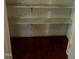 Empty pantry with two shelves and wood flooring at 6232 Dawn Dr, Hurdle Mills, NC 27541