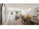Bright dining area with hardwood floors and a view of the living room at 8658 Brixton Shay Dr, Raleigh, NC 27616
